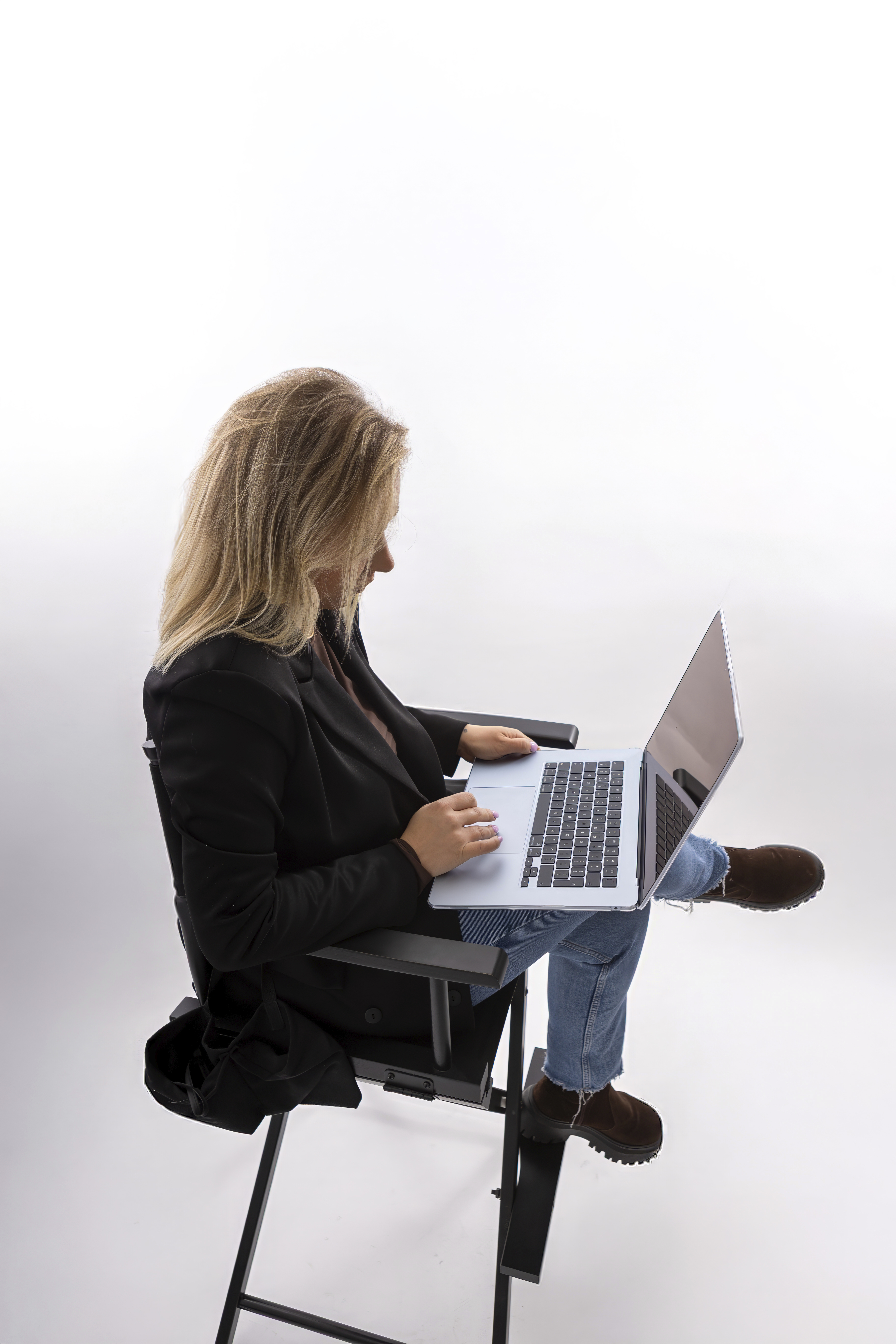 Maria Glowacka working on a laptop during the design process