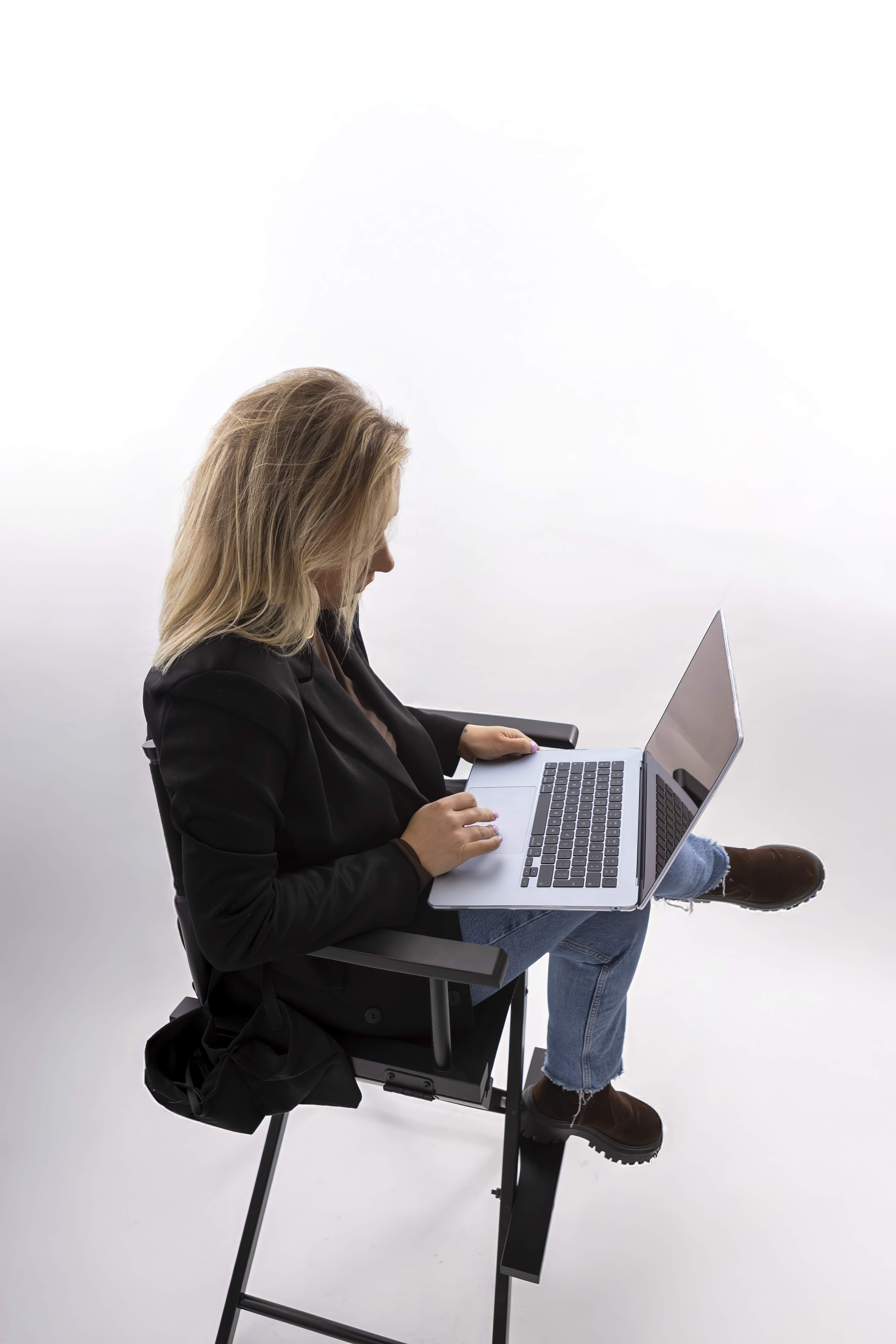 Maria Glowacka working on a laptop during the design process