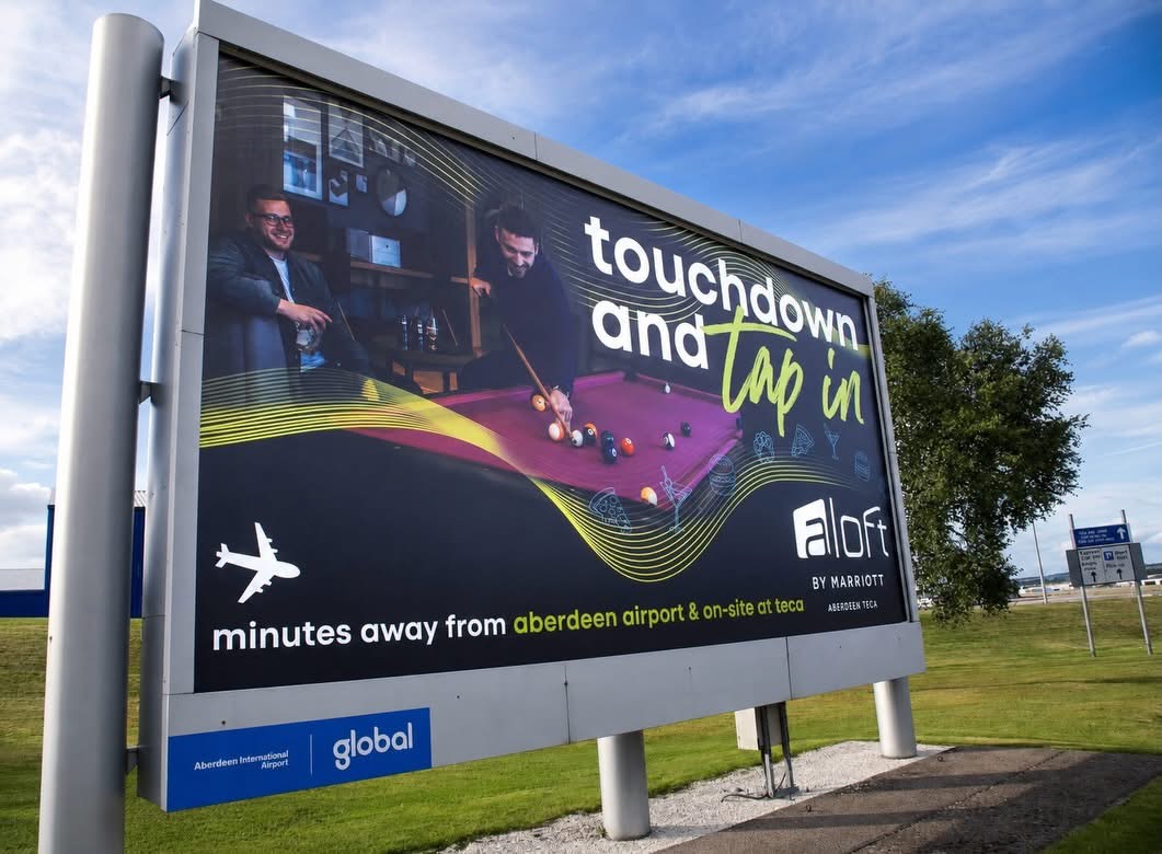 The Aloft banner installed at the entrance to Aberdeen airport